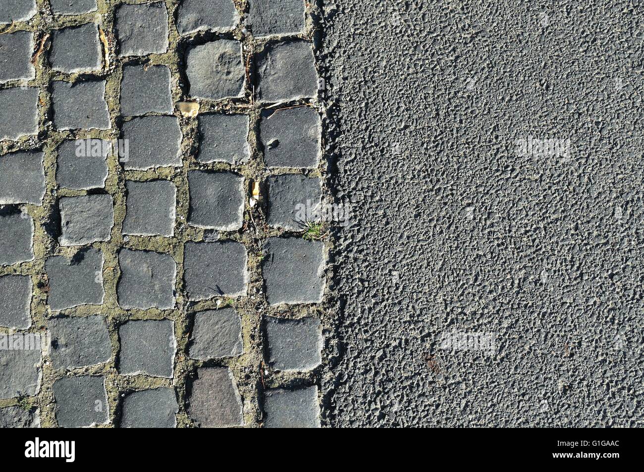 Background image of old cobblestone road and asphalt Stock Photo - Alamy