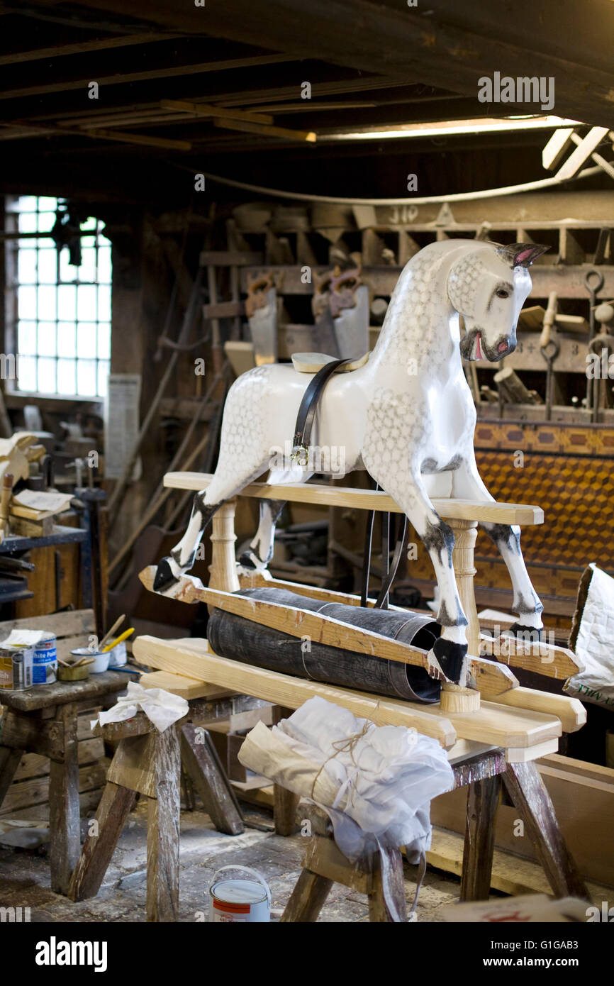 vintage rocking horse in a wood work shop Stock Photo