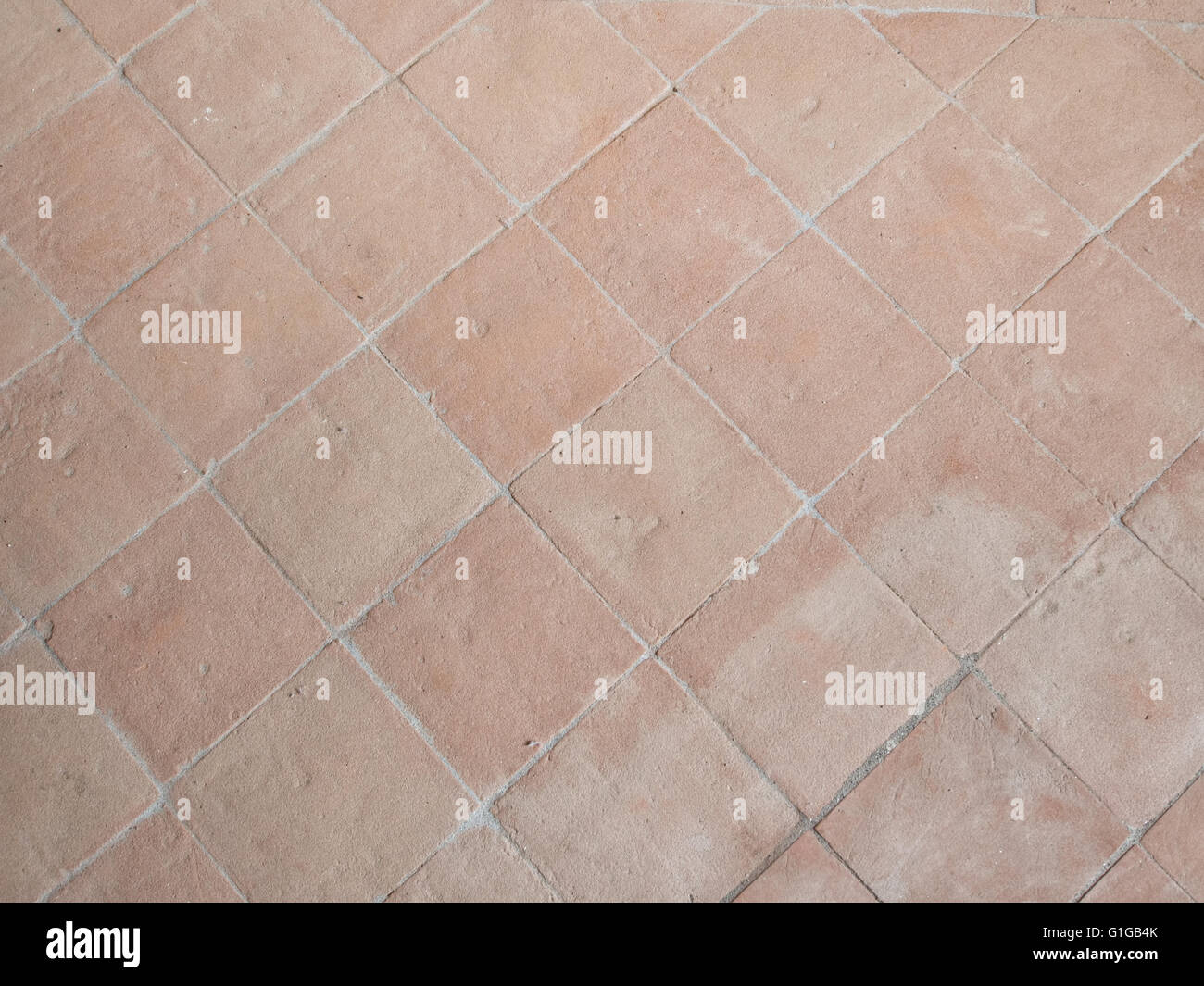 Traditional stone flooring material. Terracotta tiles. Old. Italian. Stock Photo