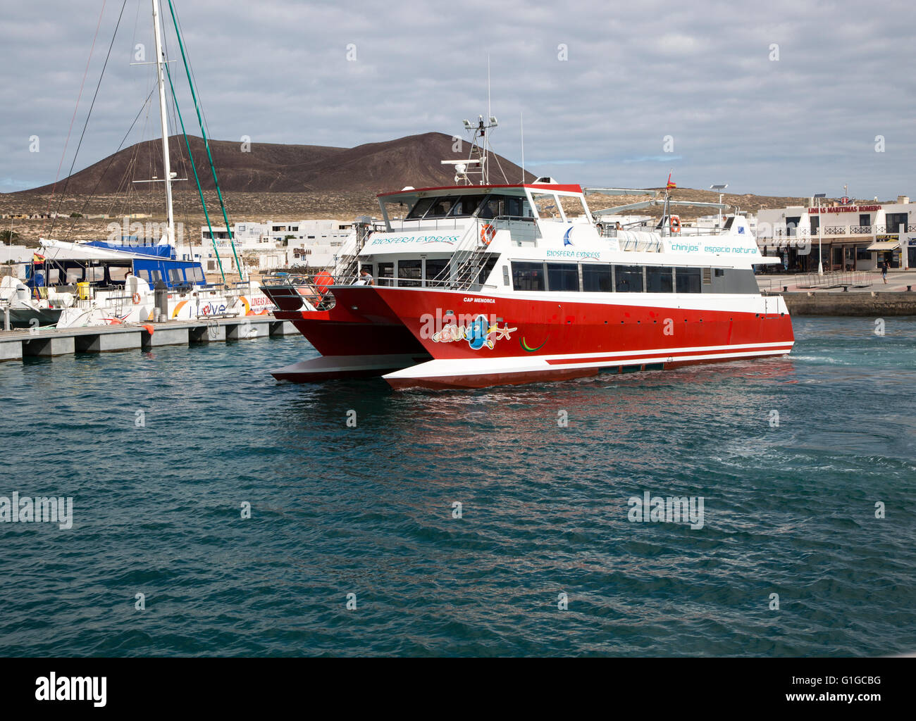 Tourist ferry boat Biosfera Express leaving the harbour Caleta de Sebo