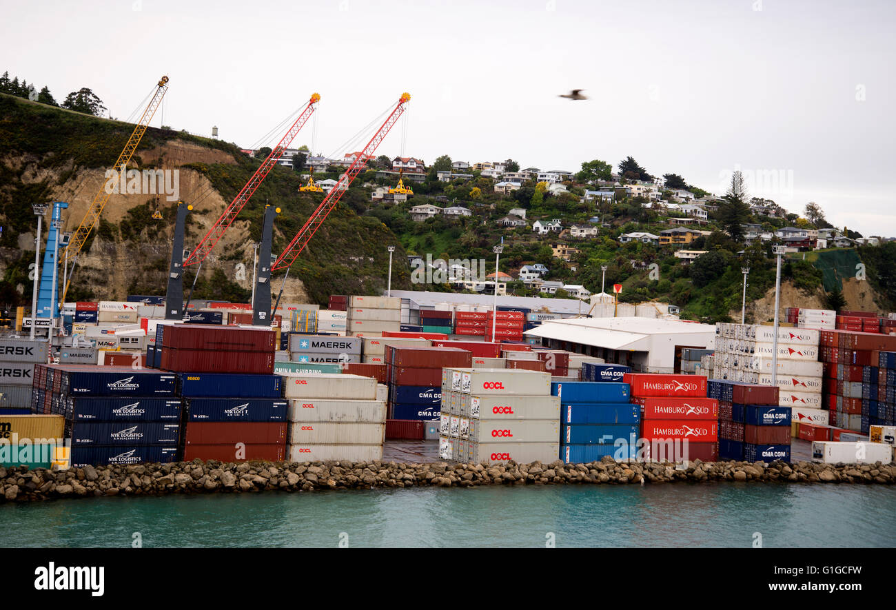 View of stacked containers on quayside in Port of Napier, New Zealand seen from Utrillo container ship as she arrives in port. Stock Photo