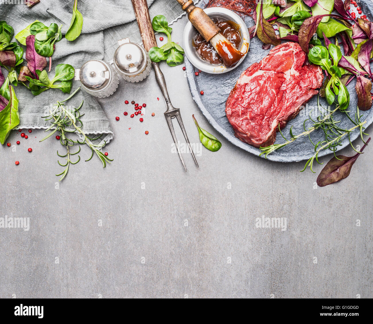 Steak and green salad. Meat preparation and marinating for grill or BBQ ...