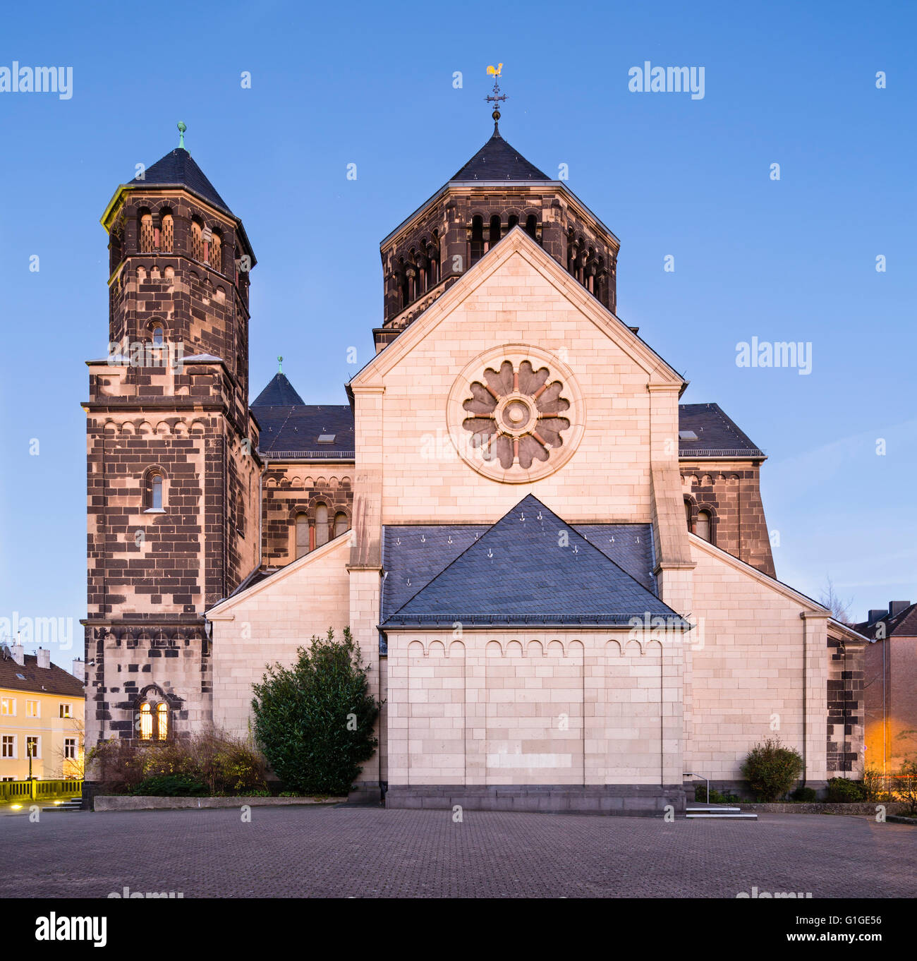 Side view of the catholic Herz-Jesu church in Aachen Burtscheid, Germany with night blue sky. Stock Photo