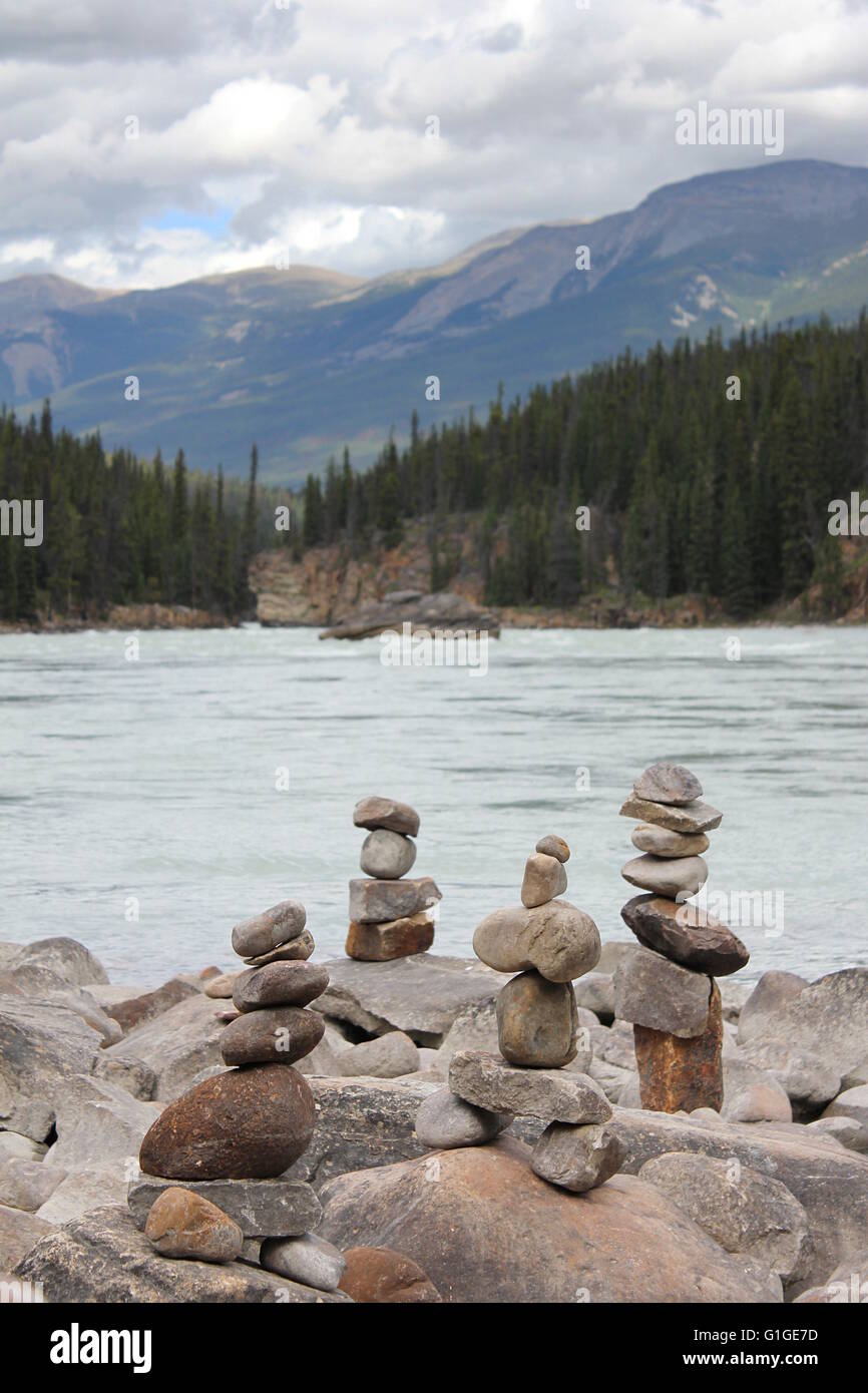 Inukshuks on the bank of the Athabasca River in Alberta, Canada. Stock Photo