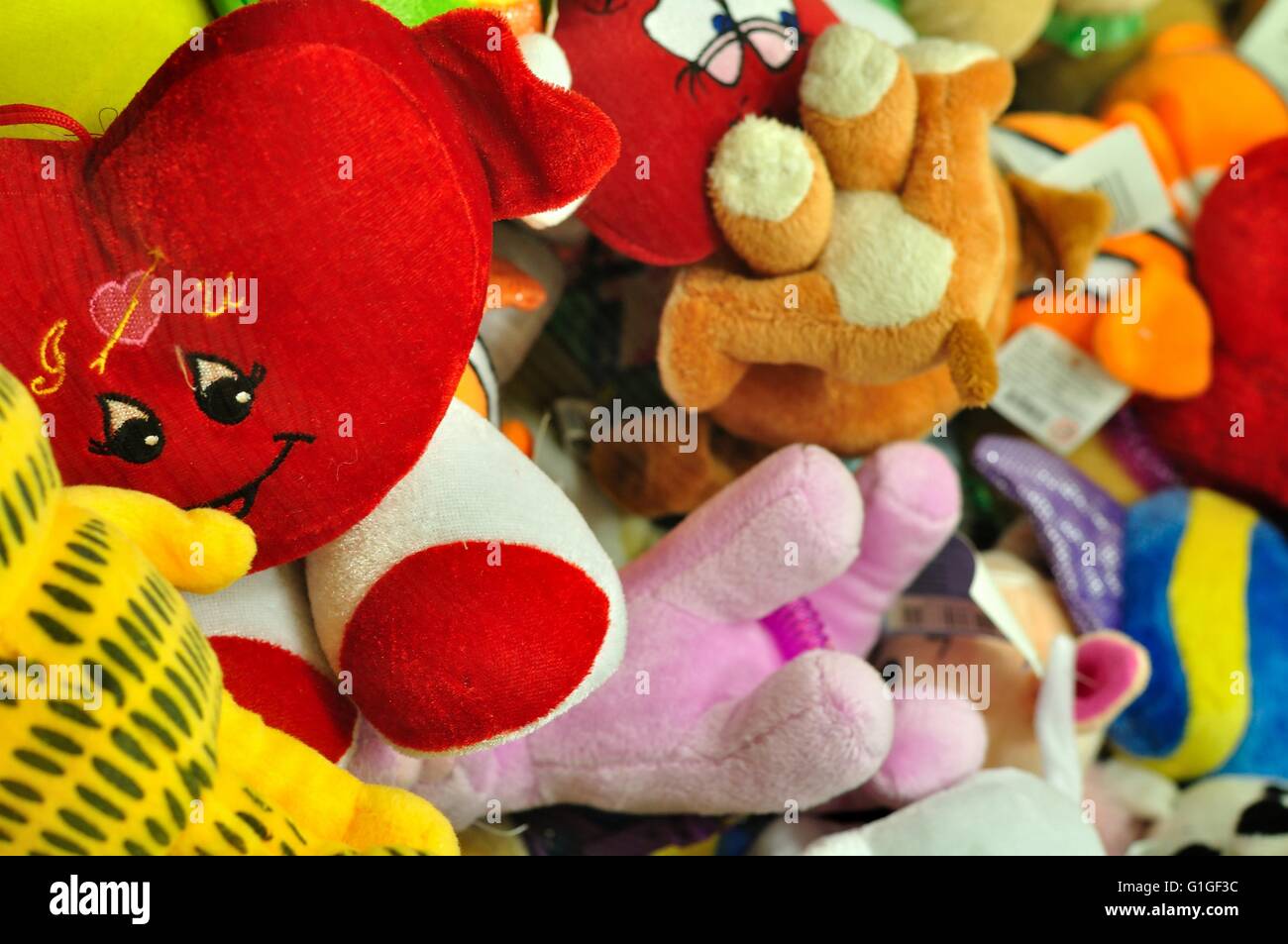 Pile of colorful stuffed animal toys for a childs Stock Photo Alamy