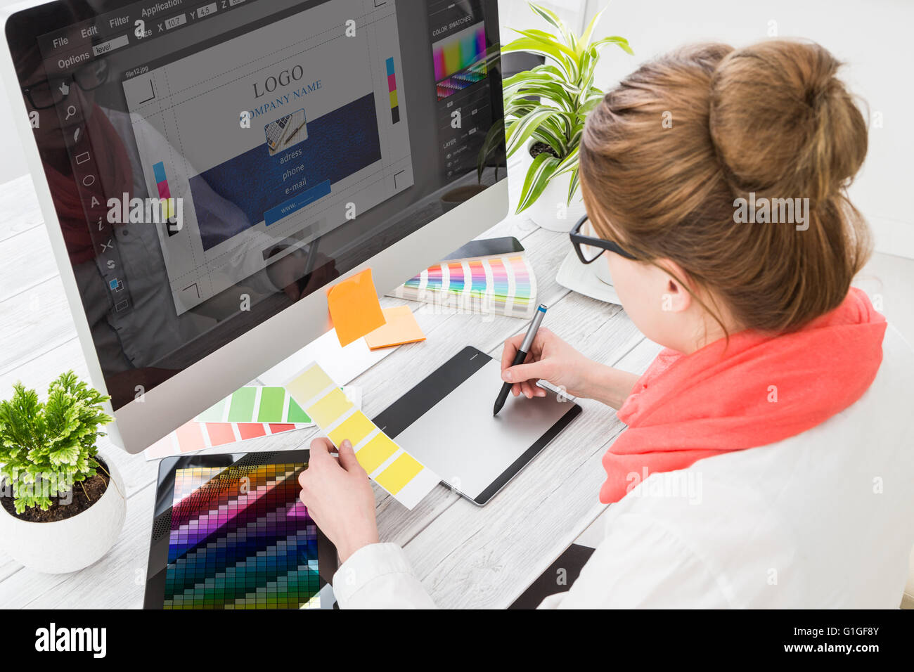 Graphic designer at work. Color swatch samples. Stock Photo
