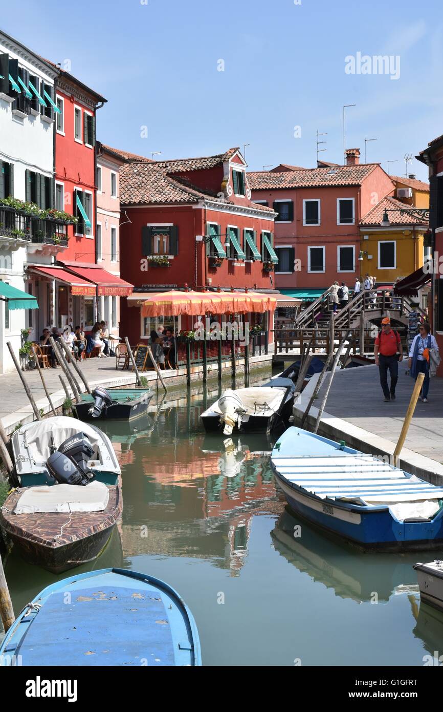 The beautiful streets of Burano island along the water canal Stock Photo