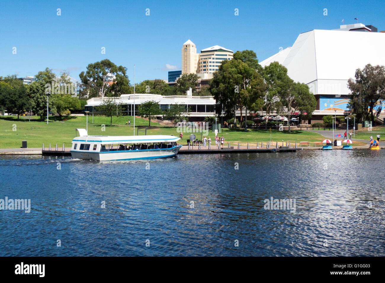 The Festival Theatre complex overlooking the River Torrens in Adelaide Australia. The tourist boat 'Popeye' is sailing past. Stock Photo
