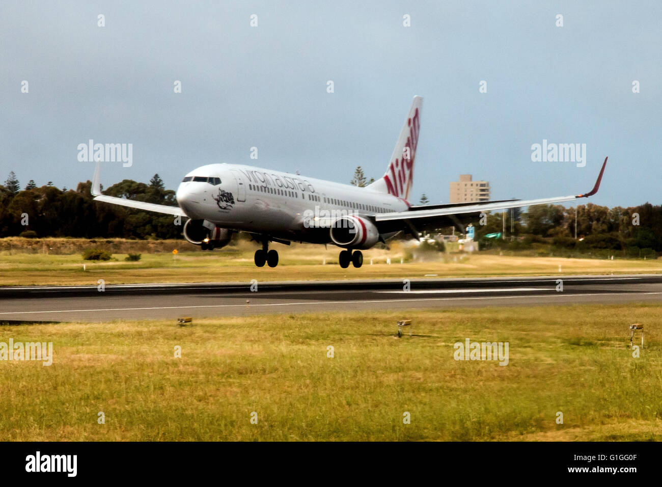 Virgin Australia aircraft landing at Coolangatta airport on the Gold Coast of Queensland Australia Stock Photo