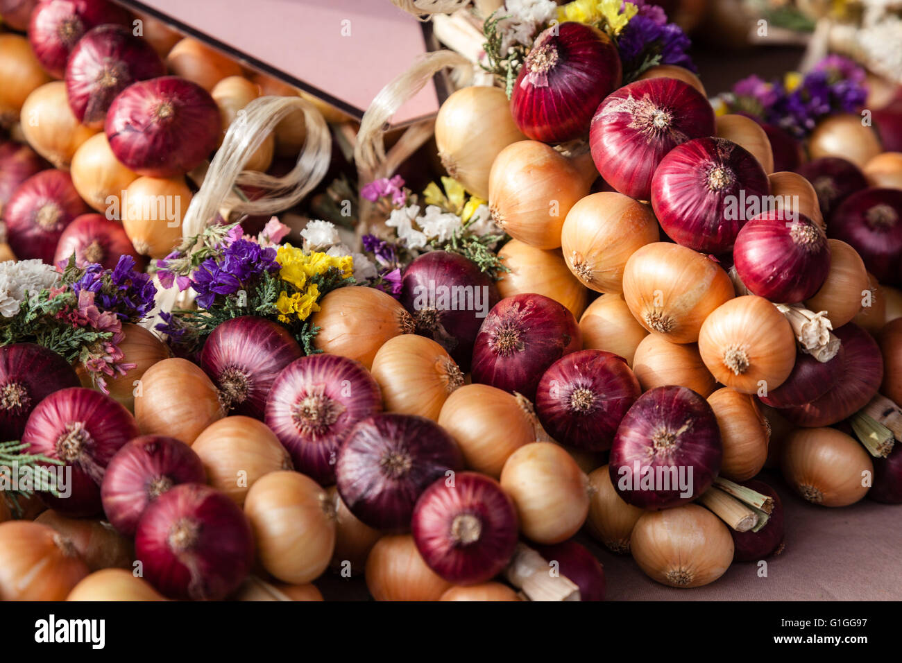 Red and White onions at a farmers market. Stock Photo