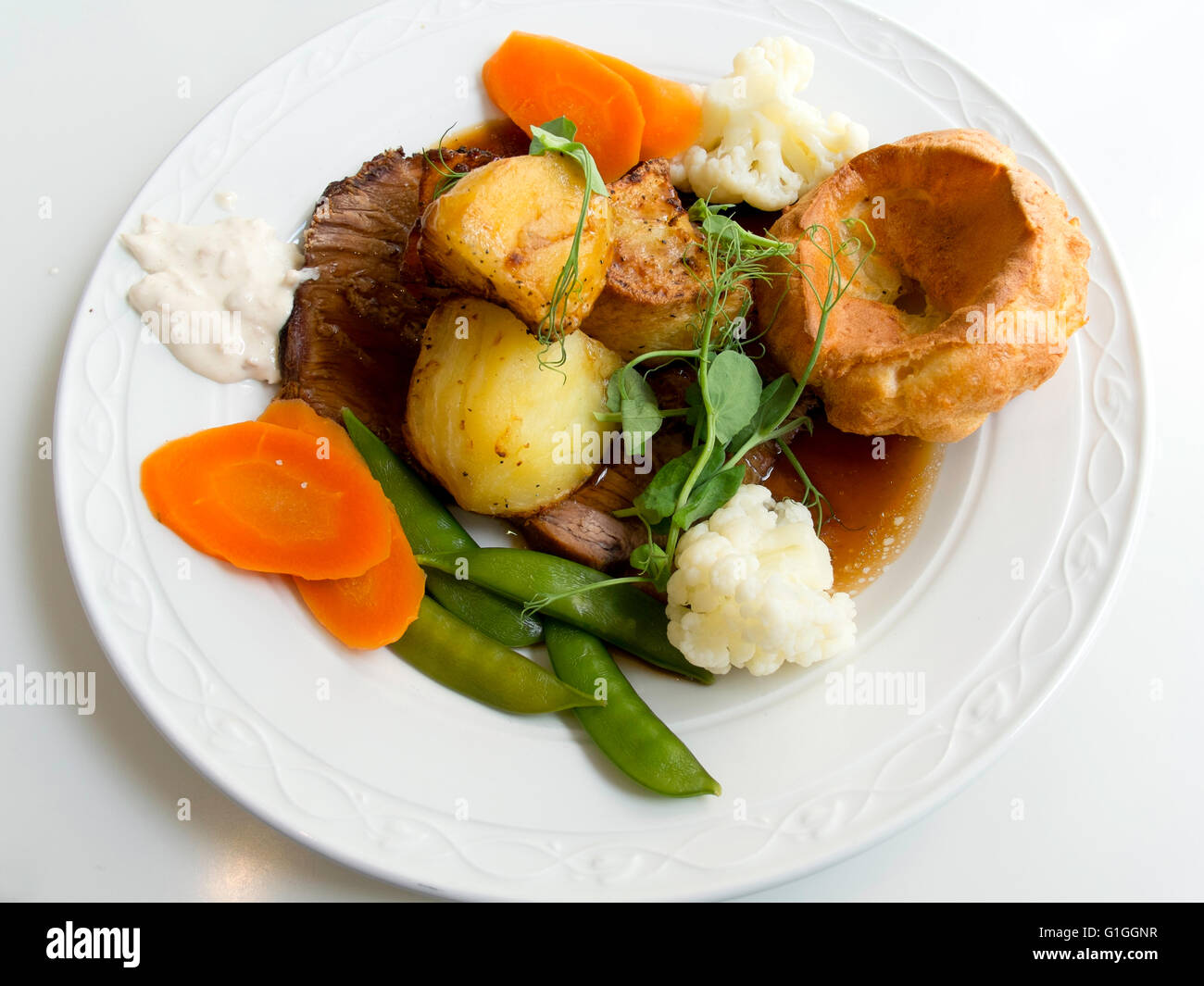 Sunday Lunch main course Roast Beef Yorkshire pudding vegetables and