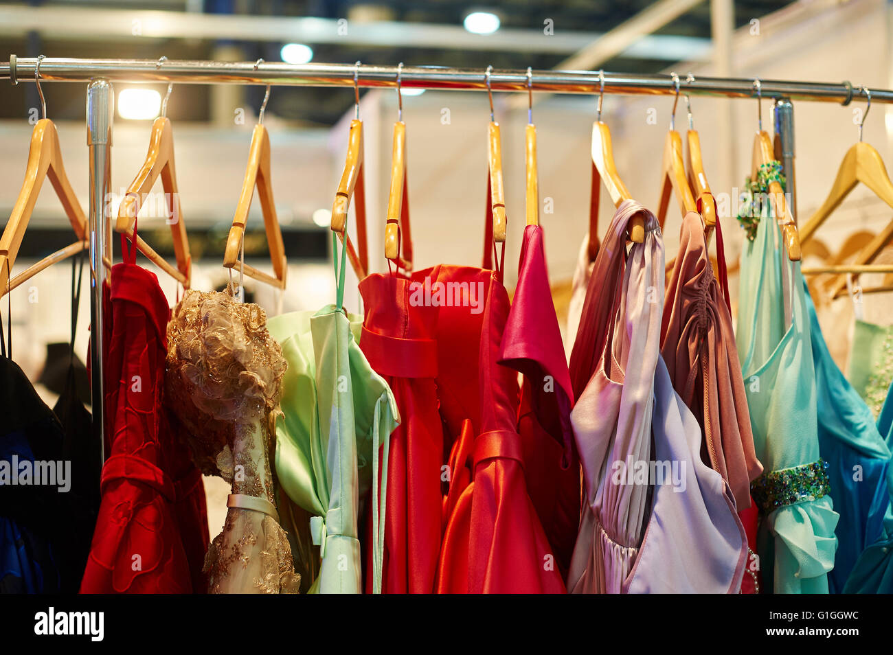 Clothes hangers with colorful clothes in a women shop. Summer sa Stock  Photo by ©Volurol 115457946