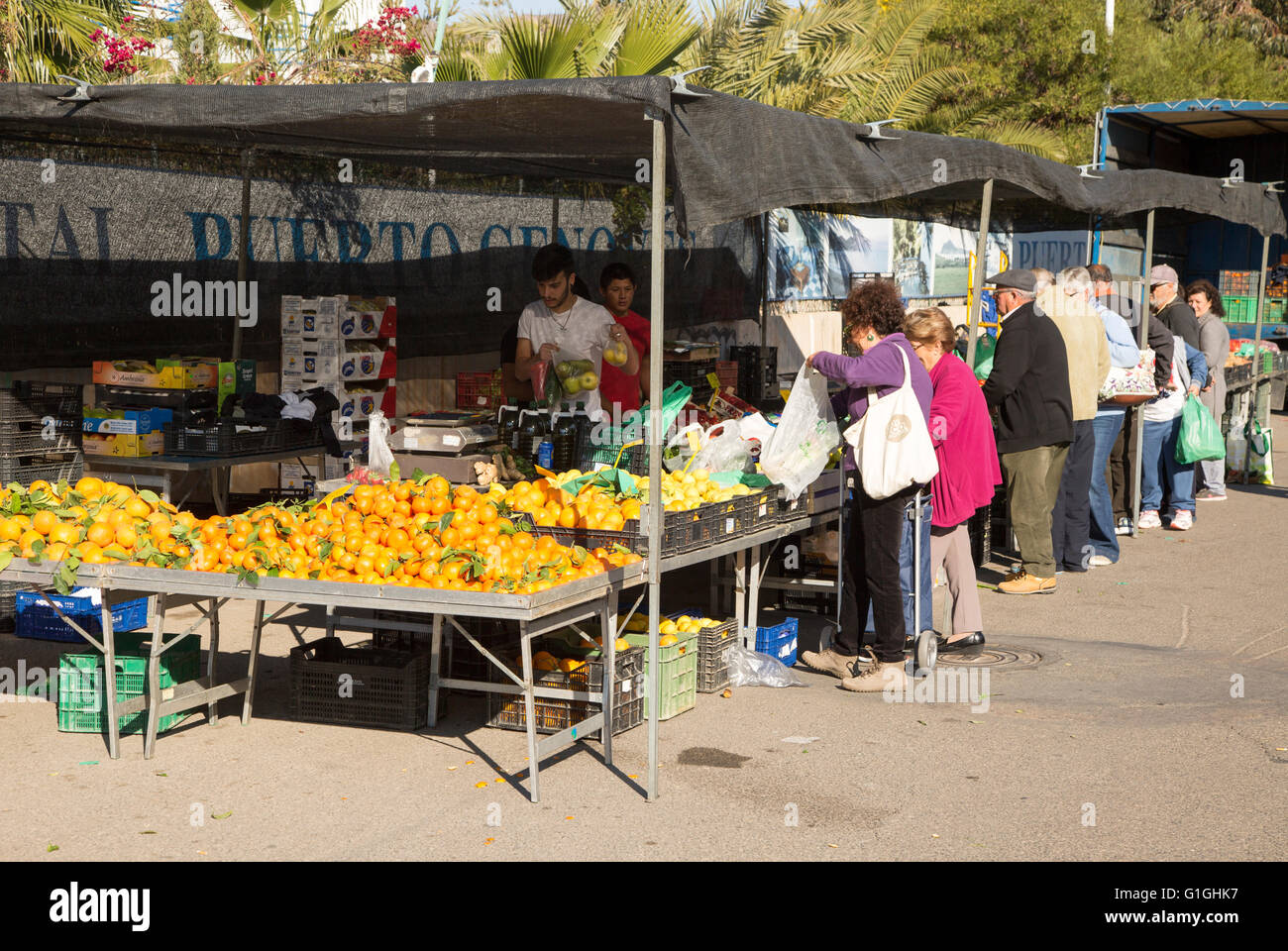 People buying fruit and vegetables at market stall, San Jose, Almeria, Spain Stock Photo