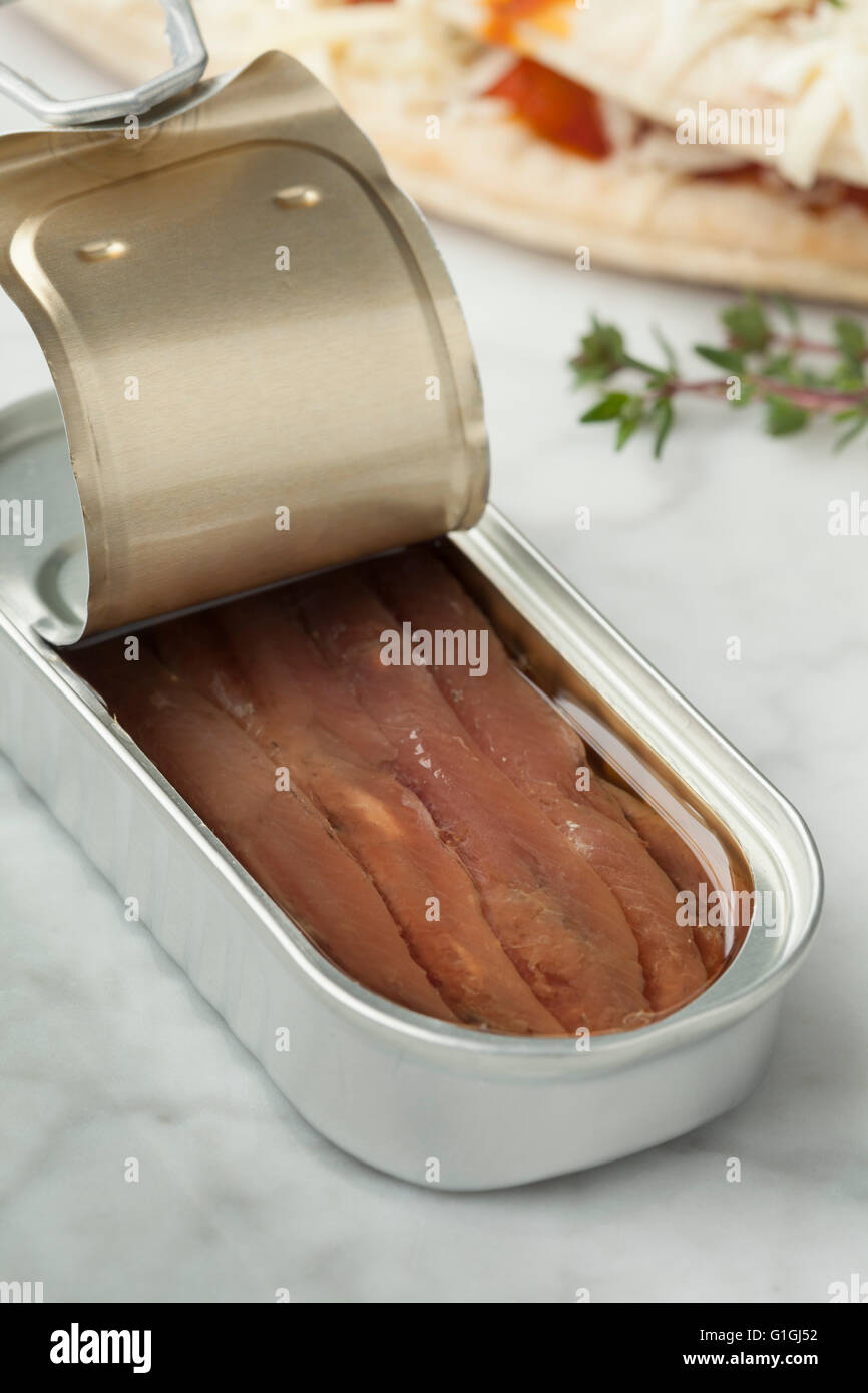 Open tin of anchovies in oil Stock Photo