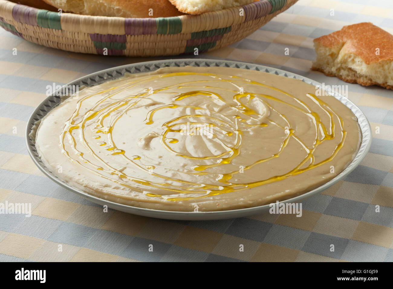 Dish with Moroccan bessara, olive oil, cumin and bread Stock Photo