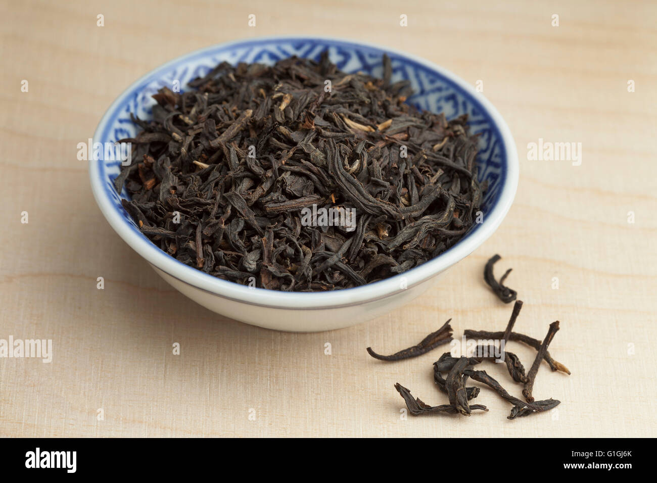 Chinese bowl with dried Nan-Yu tea Stock Photo