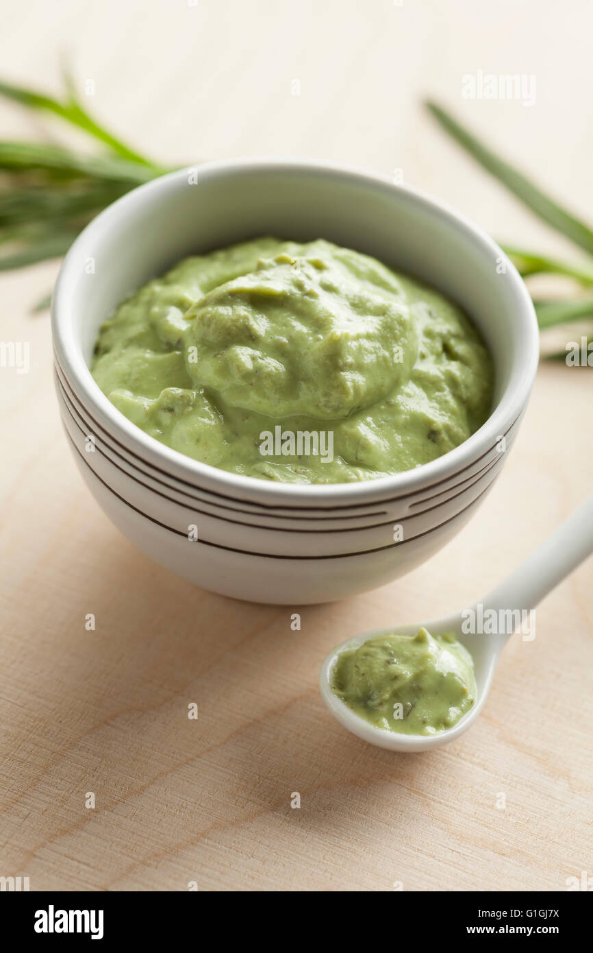 Traditional green French tarragon mustard in a bowl Stock Photo