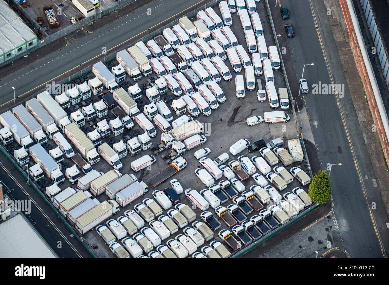 Aerial photo of parking lot with white vans tightly packed in Stock Photo -  Alamy