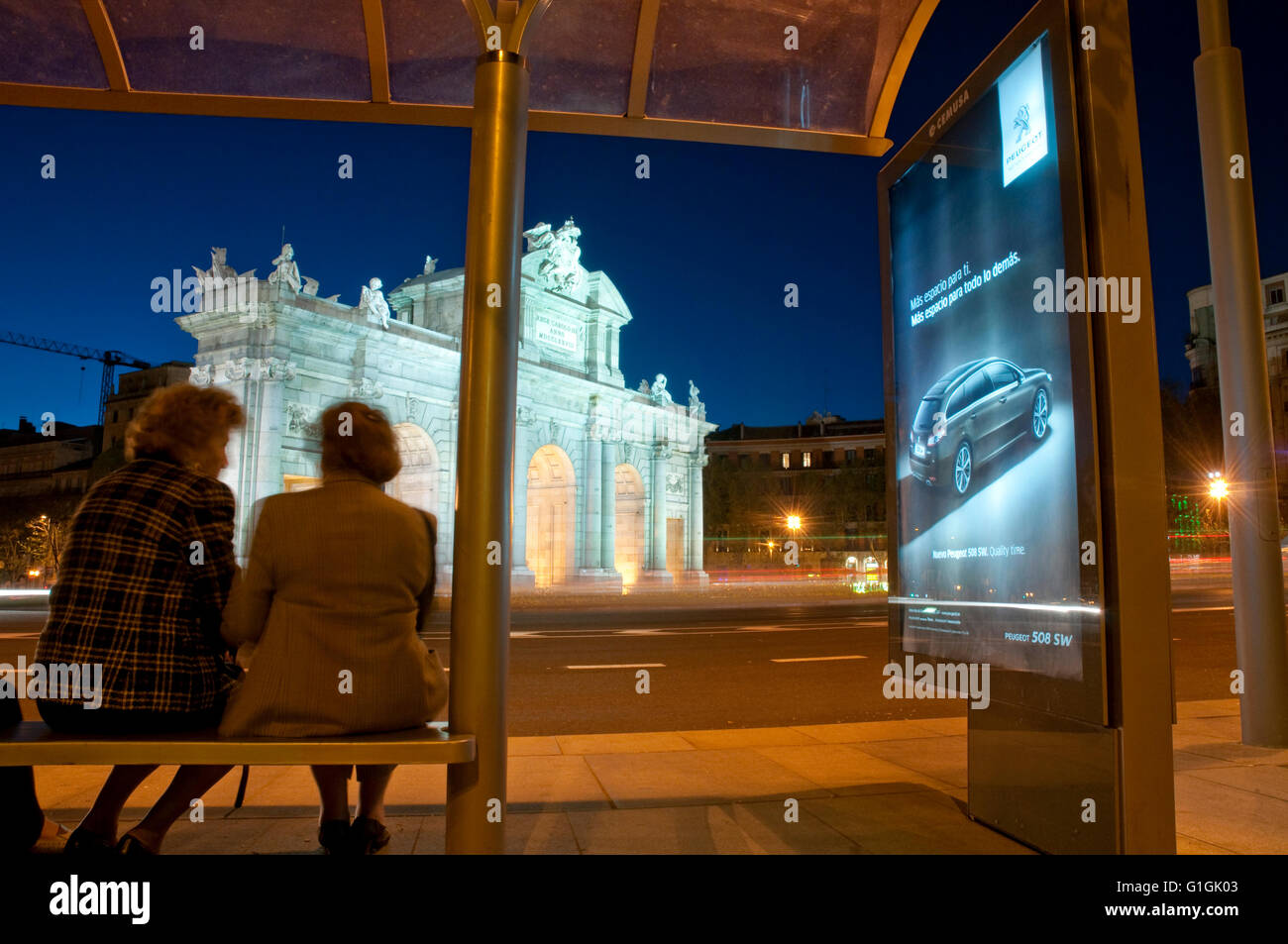 Bus stop in Independencia Square, night view. Madrid, Spain. Stock Photo