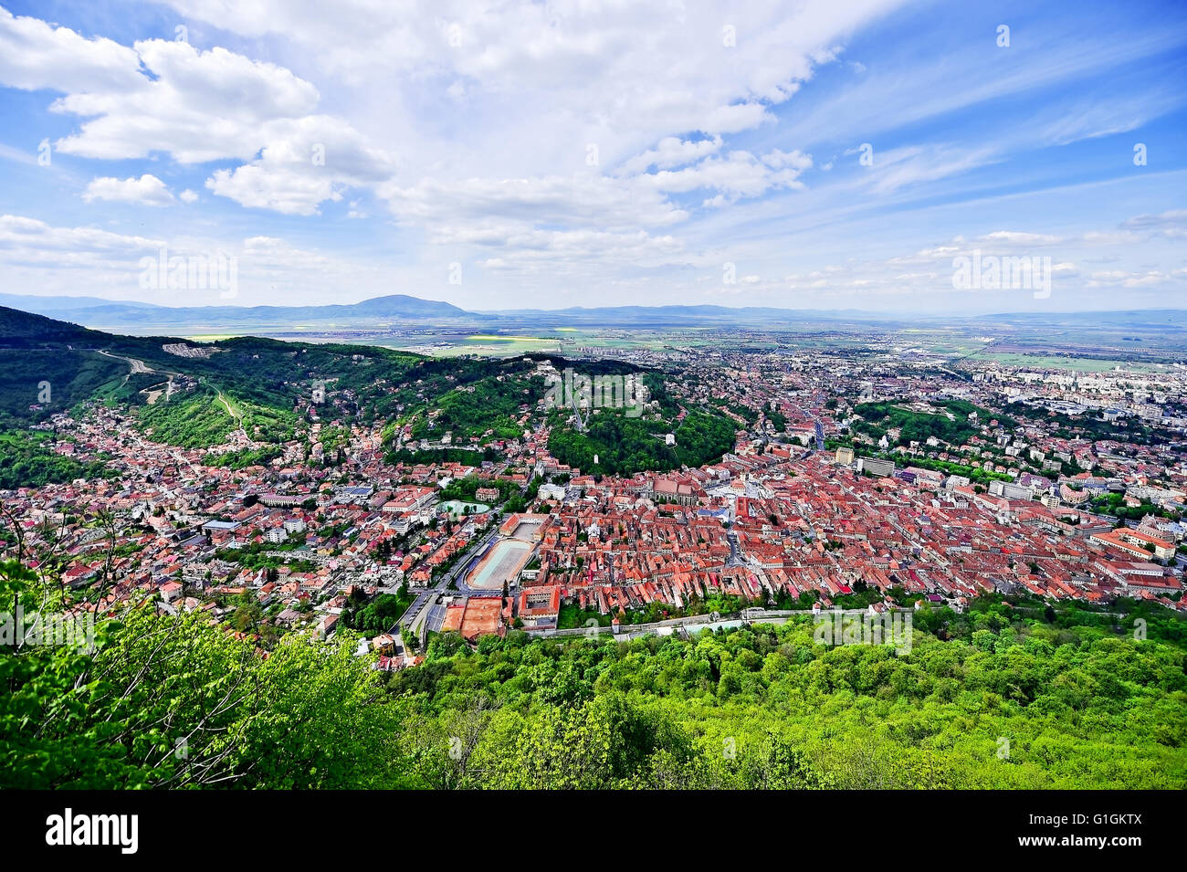 Aerial photo with Transylvania's Brasov medieval old town in springtime Stock Photo