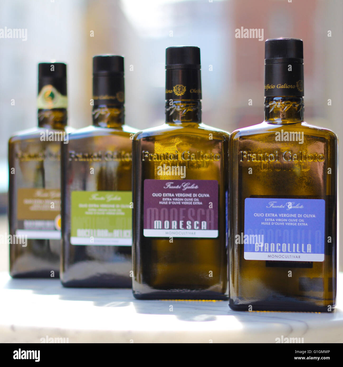 A selection of 4 different oils sat on a marble table in central London. Stock Photo