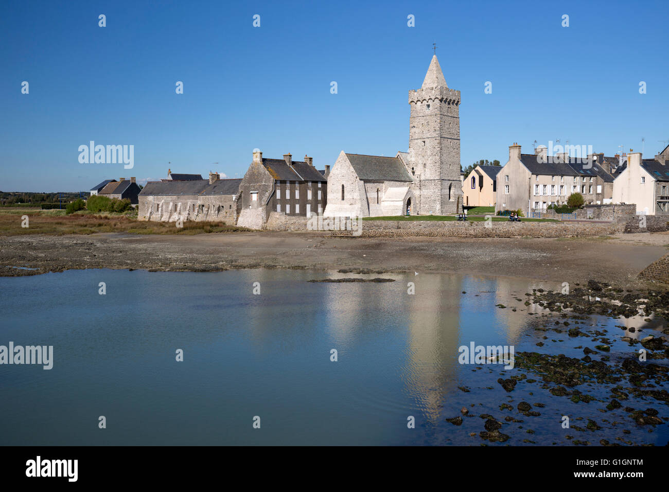 View of church and lagoon of channel coast town, Portbail, Normandy, France, Europe Stock Photo