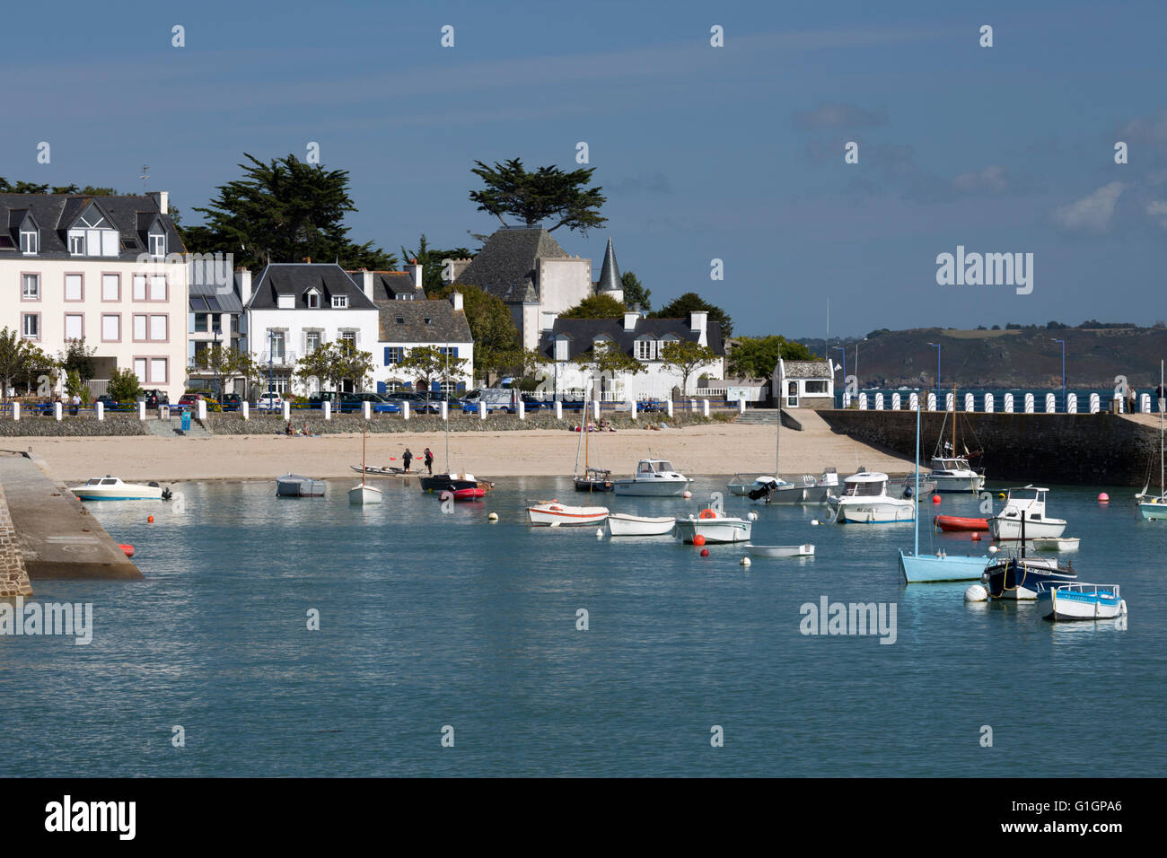 View of beach and boats in harbour, Locquirec, Finistere, Brittany, France, Europe Stock Photo