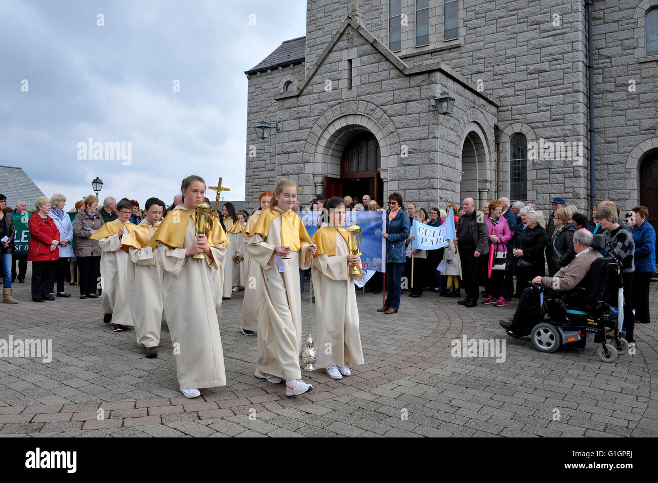 Girl altar servers in procession outside the Sacred Heart church, Carndonagh, County Donegal, Ireland. Stock Photo