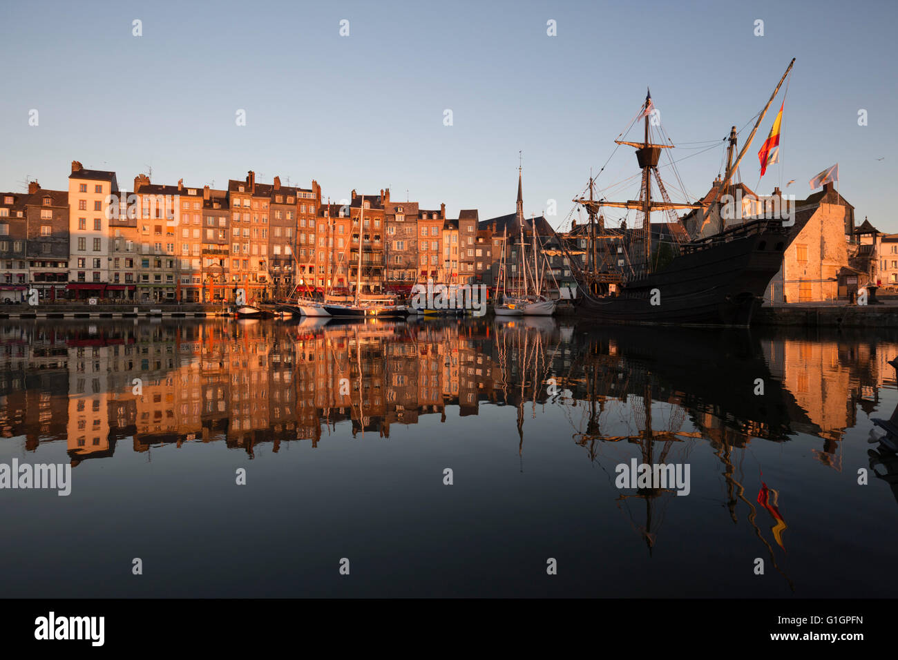 Vieux Bassin looking to Saint Catherine Quay with replica galleon at dawn, Honfleur, Normandy, France, Europe Stock Photo