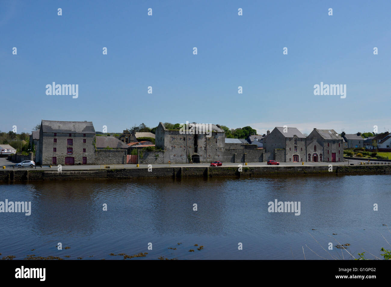 19th century warehouses and River Lennon, Ramelton, County Donegal, Ireland. Stock Photo