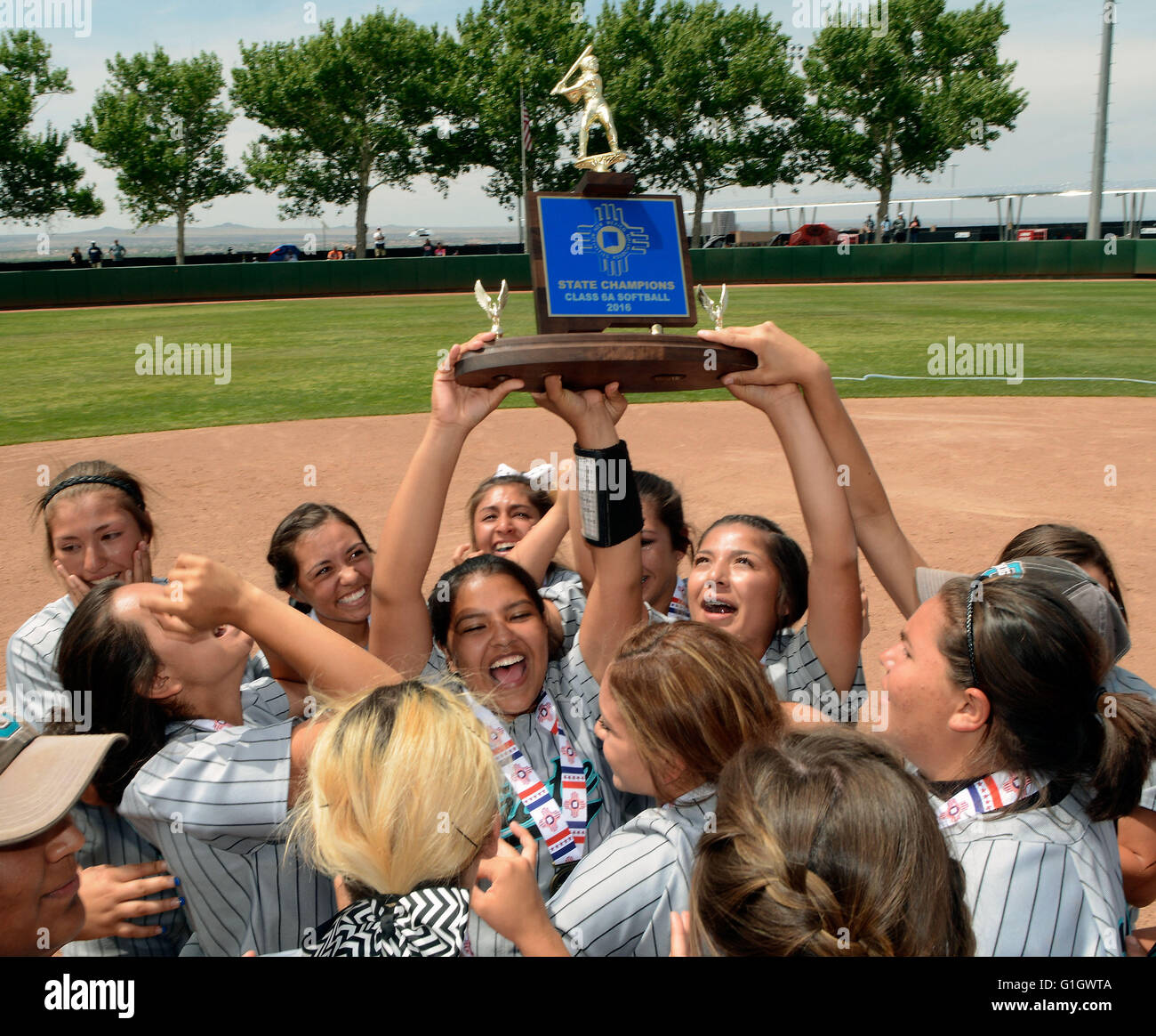 Albuquerque, NM, USA. 14th May, 2016. The members of the O''“ate softball team raise the championship trophy into the air after beating Cleveland for the 6A Girls Softball Championship. Saturday, May 14, 2016. © Jim Thompson/Albuquerque Journal/ZUMA Wire/Alamy Live News Stock Photo