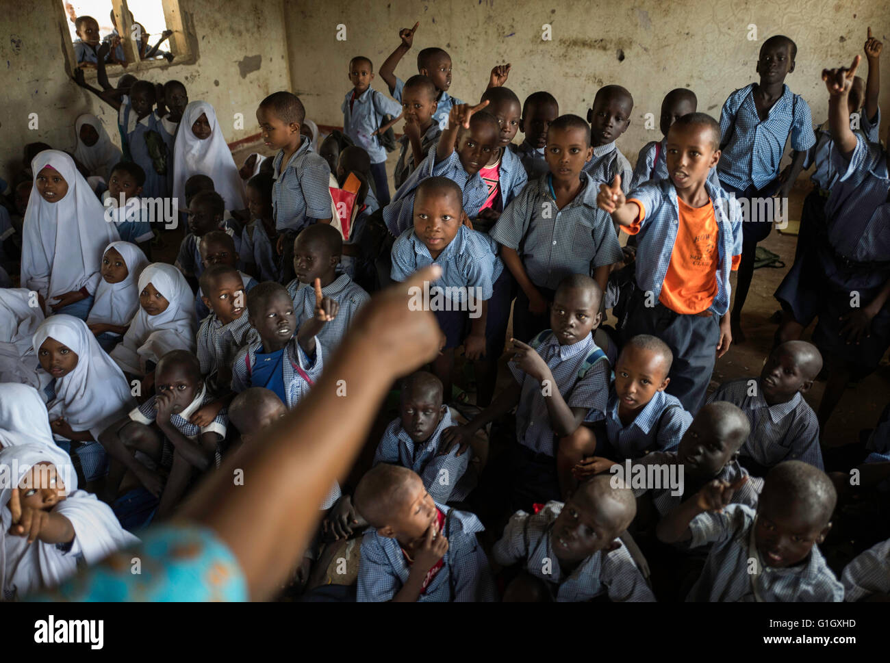 Joseph Waiyaki asks for a Somali boy to come forward and chooses Abdi Rashid (right) in Mogadishu Primary School in Kakuma 1, one of the four camps in Kakuma, Kenya, 09 May 2016. Photo: Dominic Nahr/dpa Stock Photo
