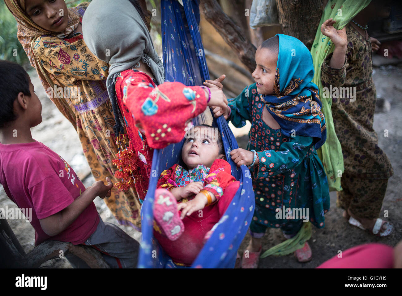 (160515) -- BEIJING, May 15, 2016 (Xinhua) -- Pakistani refugee children play in a slum on the outskirts of Tehran, capital of Iran, on May 12, 2016. (Xinhua/Ahmad Halabisaz) Stock Photo