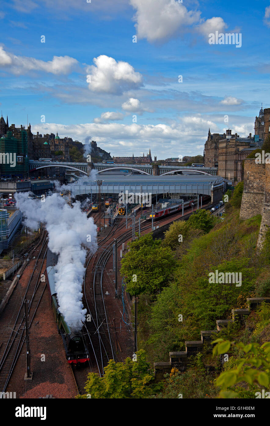Edinburgh, Scotland, UK, 15 May 2016. The Flying Scotsman locomotive leaves Waverley Station for its day trip to the Scottish Borders on a fine sunny morning. Stock Photo