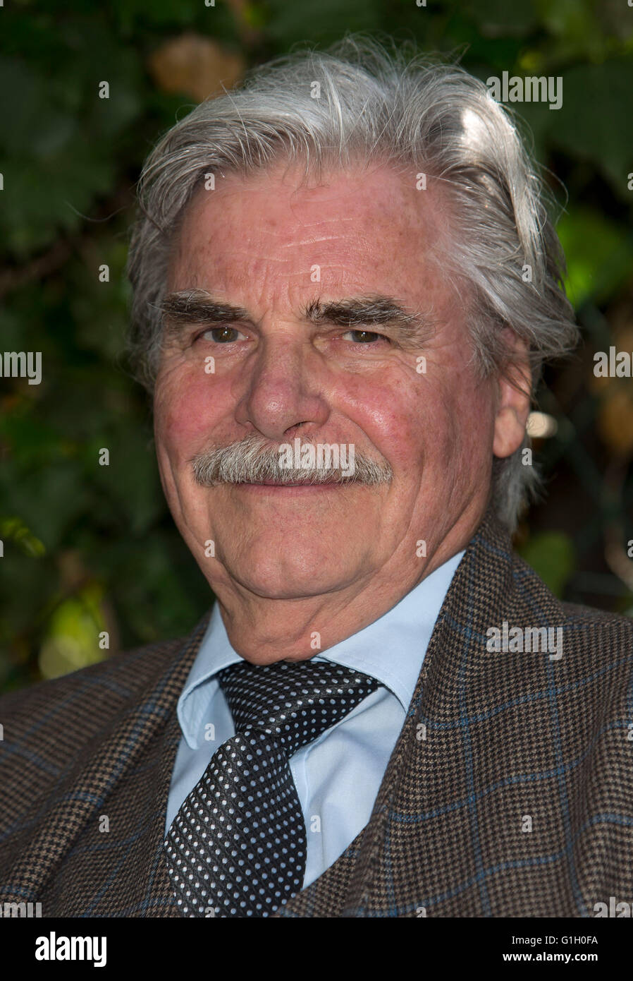 Actor Peter Simonischek poses before an interview to promote 'Toni Erdmann' during the 69th Annual Cannes Film Festival at Palais des Festivals in Cannes, France, on 15 May 2016. Photo: Hubert Boesl Stock Photo