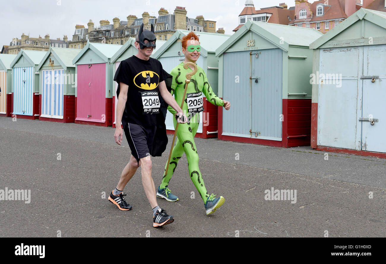 Hove Brighton UK 15th May 2016 - Batman and The Joker arrive to take part in the Heroes v Villains Save the Day charity run along Hove seafront today raising money for Pass It On Africa  Credit:  Simon Dack/Alamy Live News Stock Photo