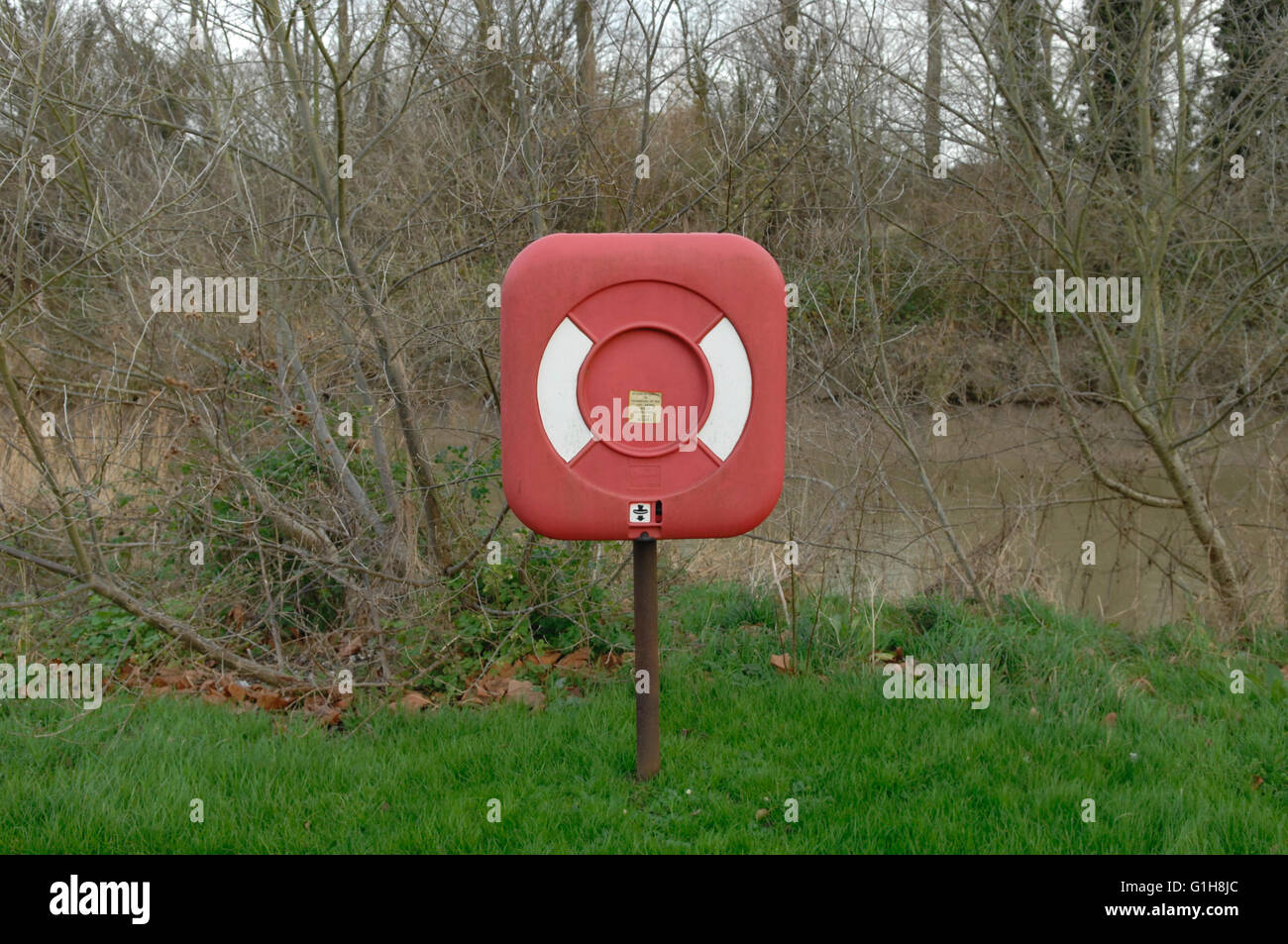 lifebuoy next to river in Sandwich - Kent, United kingdom Stock Photo