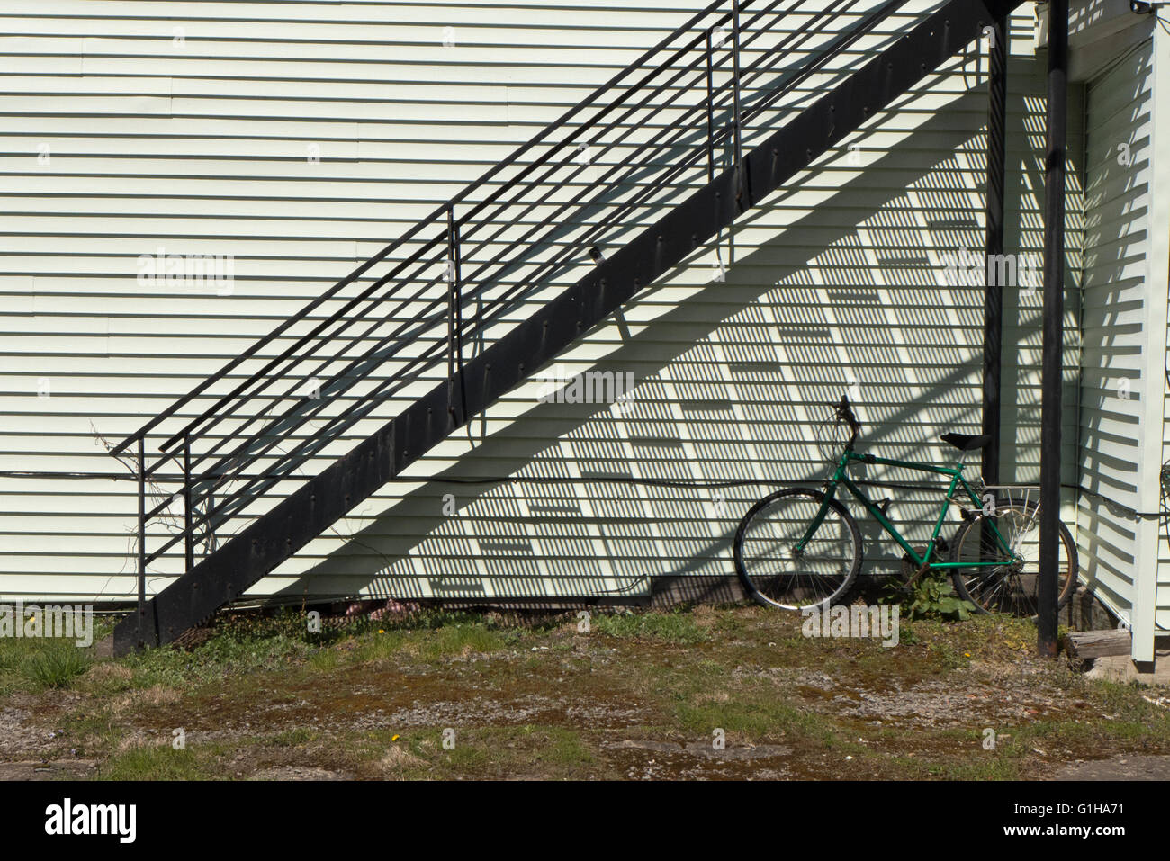 Steel staircase casting shadow Stock Photo - Alamy