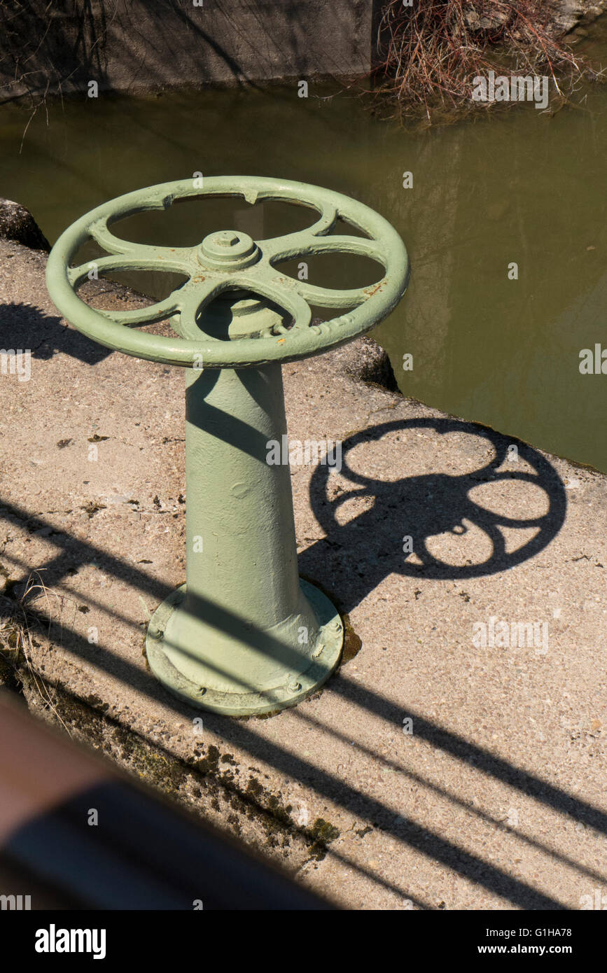 Wheel to lower water level. Stock Photo