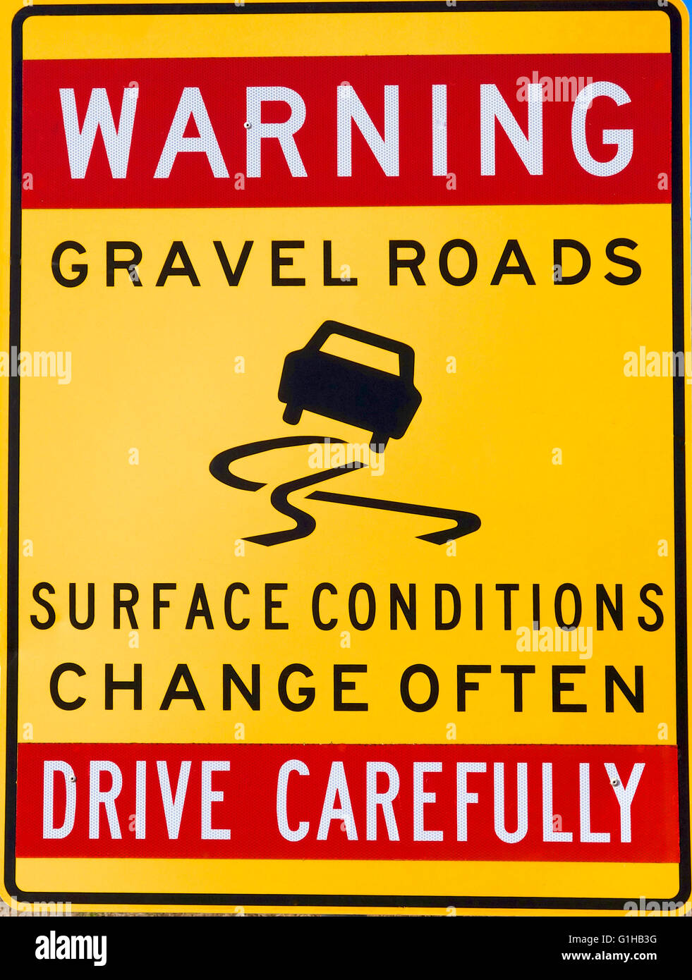 Warning: Gravel road sign Stock Photo