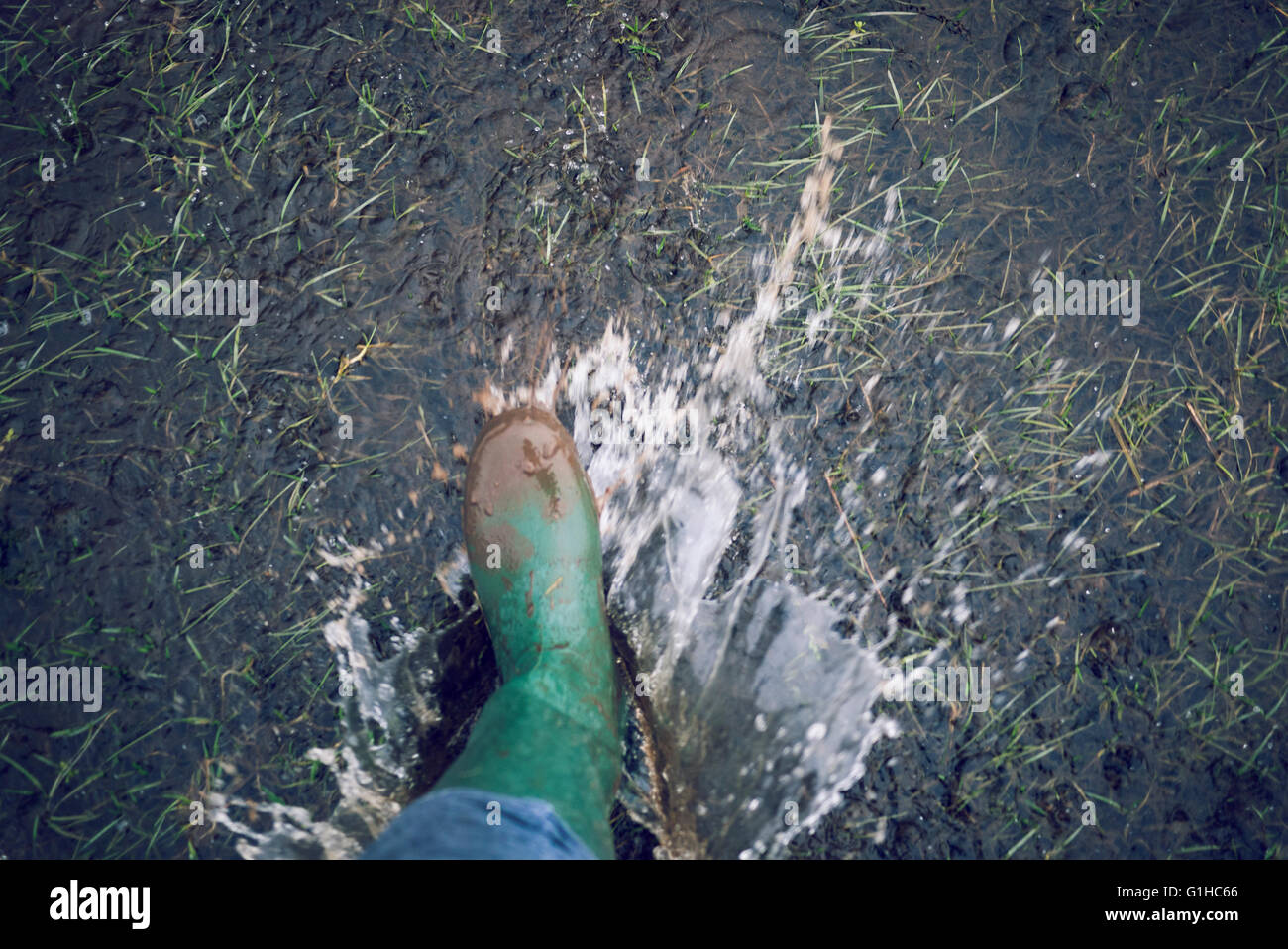 Welly boots - Enjoying wet weather Stock Photo