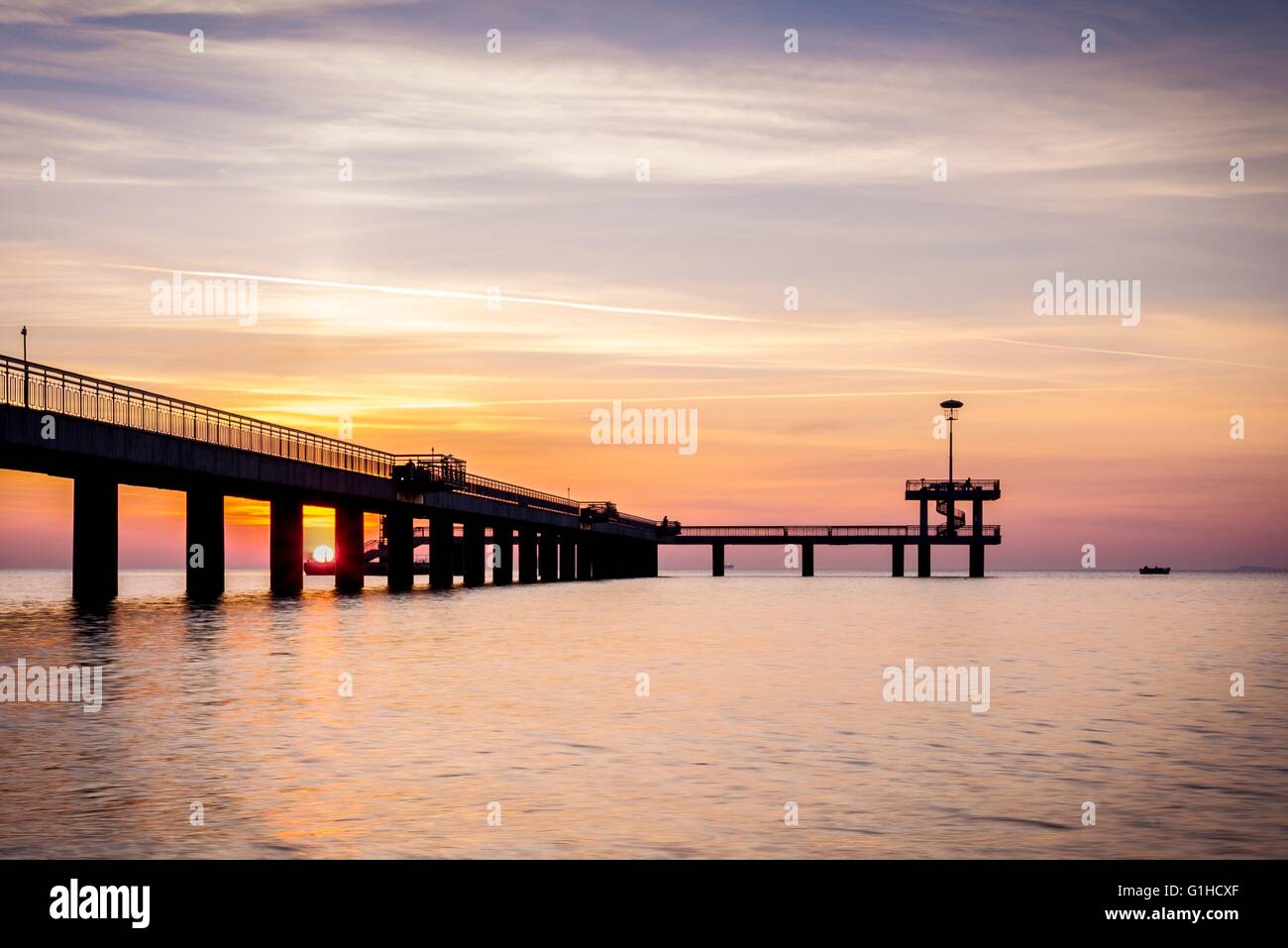 Sunrise over the sea bridge in Bourgas bay, Bulgaria Stock Photo