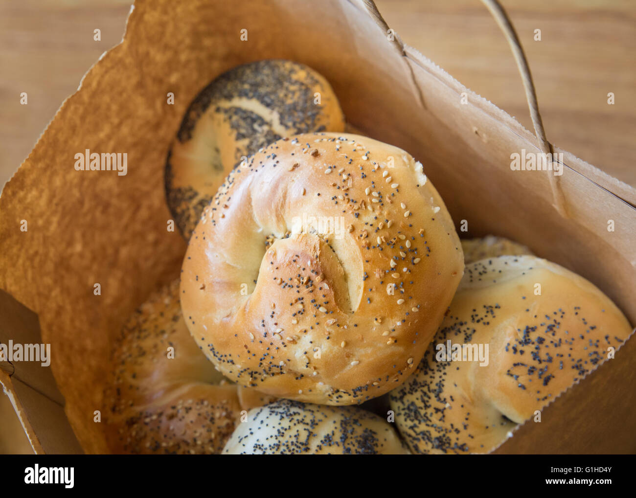 Variety of New York style bagels in brown paper bag Stock Photo Alamy