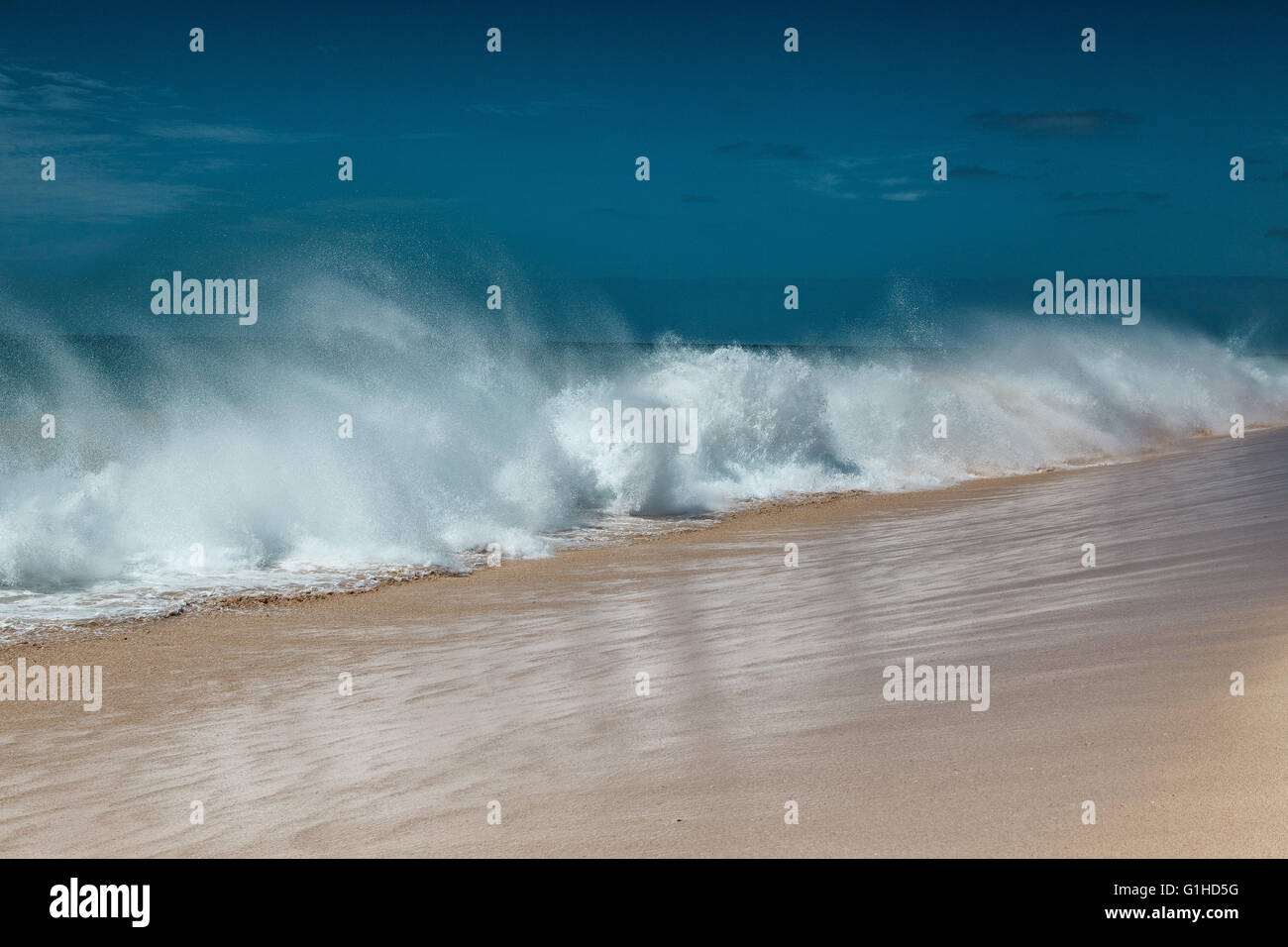 Ocean waves breaking at Cape Verde sandy beach in summer on a sunny day ...