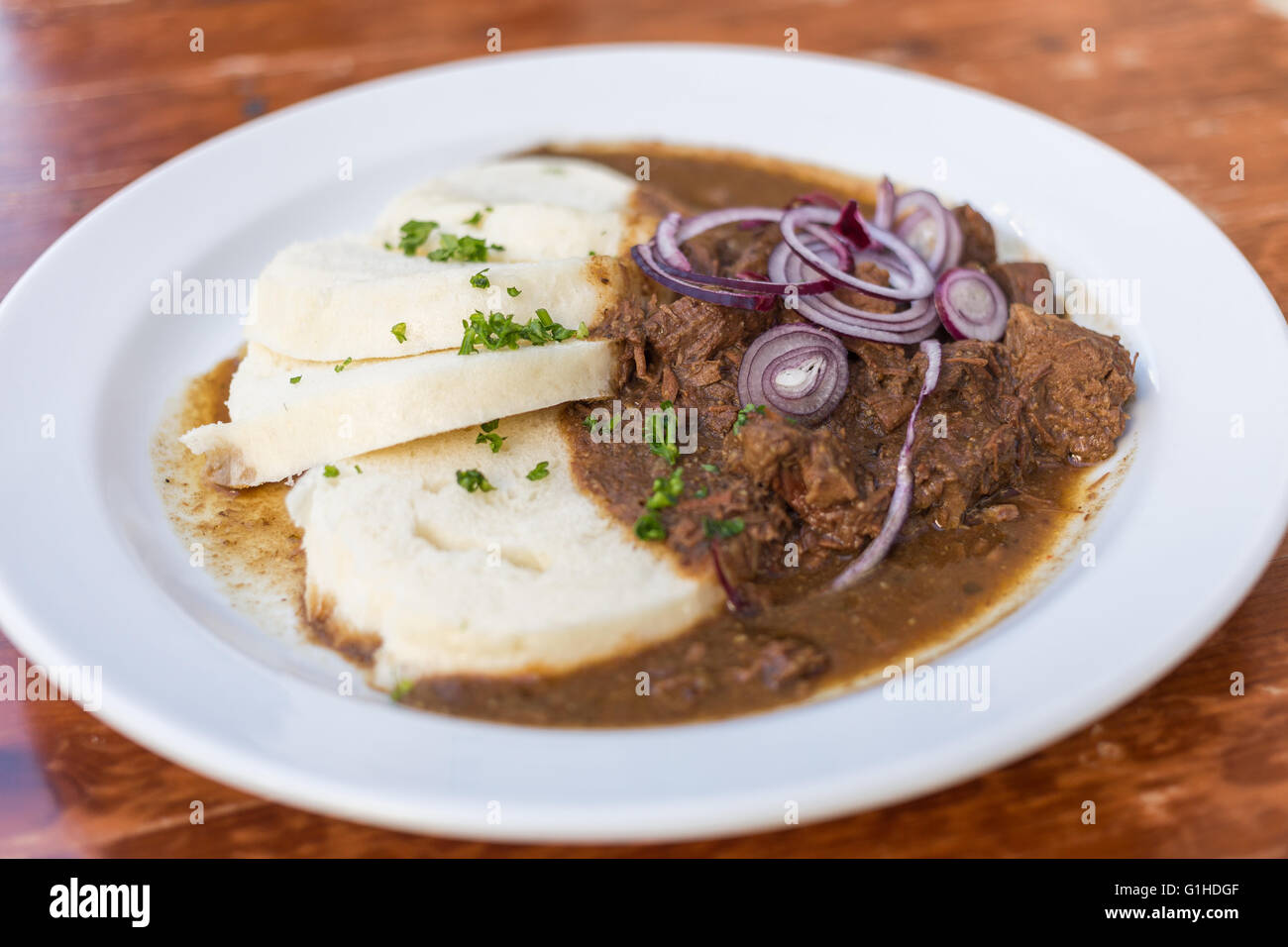 Typical serving of Beef Goulash and Bread Dumplings Stock Photo Alamy