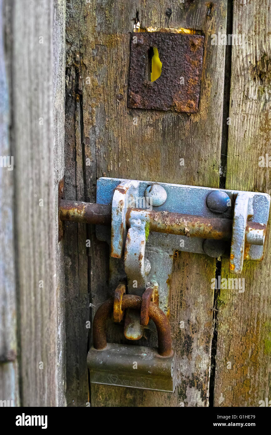 Old wood textured door and rusty iron door lock close up Stock Photo ...