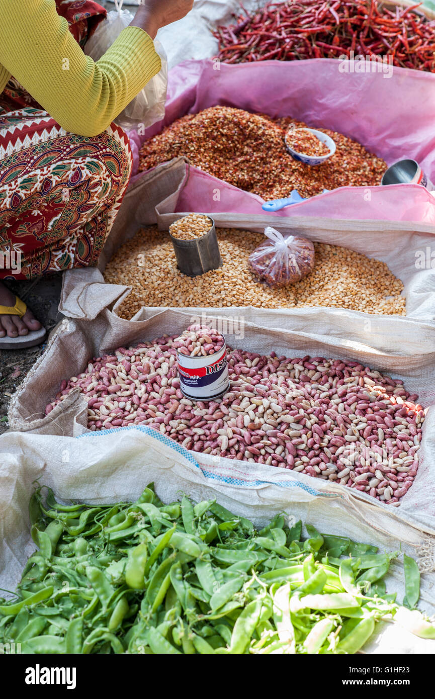 Different spices and beans on a food Market in Myanmar Burma. Lentils,peas,chili,red orange and green colors.sell Stock Photo