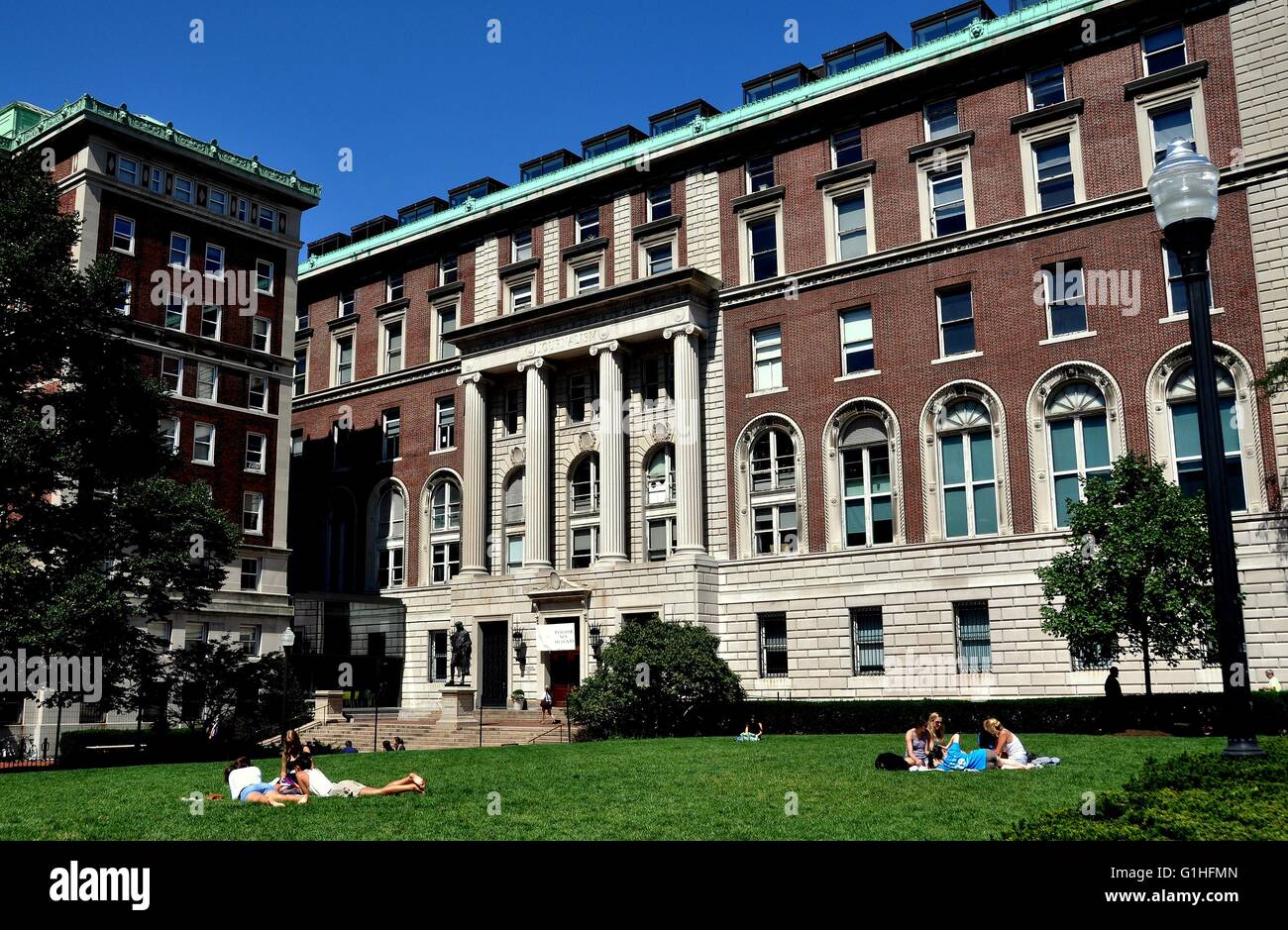 New York City:  Students studying on the lawn in front of the Columbia University School of Journalism Stock Photo