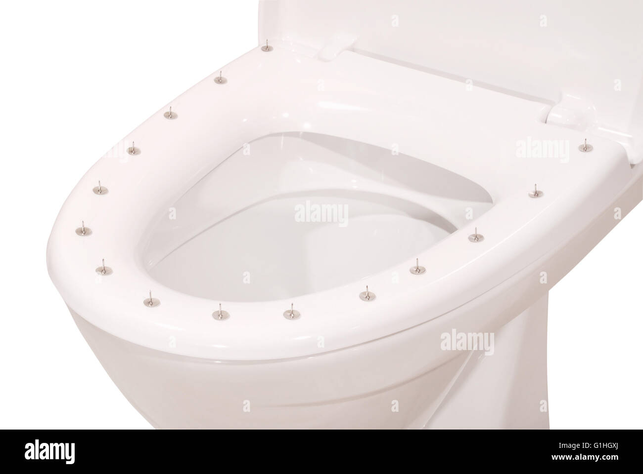 Thumbtacks on the lid of the toilet on white. Clipping path included. Stock Photo