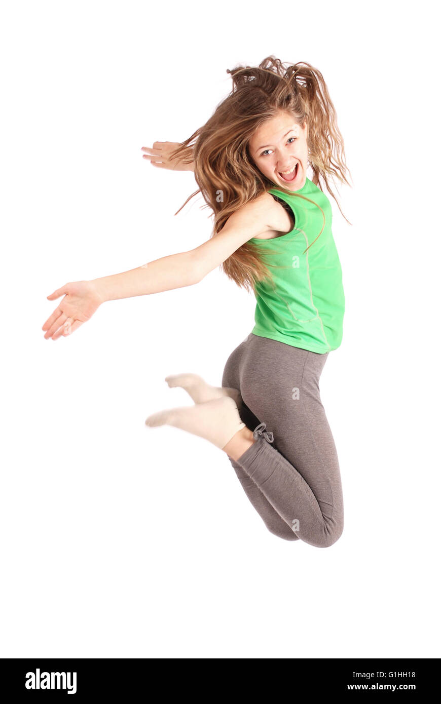 Girl jumping isolated on white studio background Stock Photo - Alamy